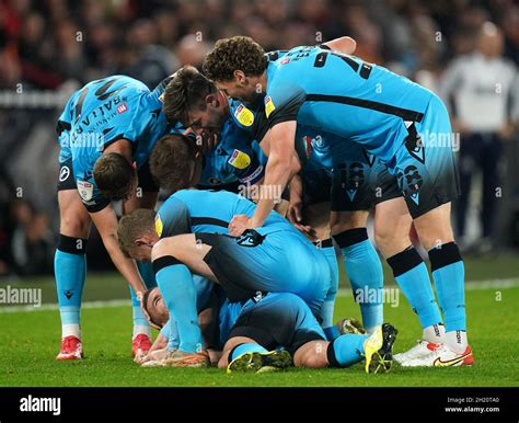 Millwall's Jed Wallace (ground) celebrates scoring their side's first ...