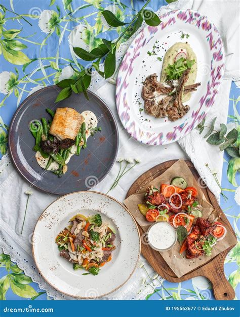 Set of Four Meat and Fish Dishes Business Lunch Combo on the Table at