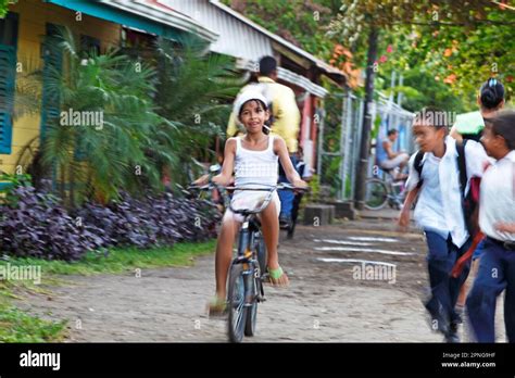 Costa Rican Girl On A Bicycle Blur Tortuguero National Park Limon