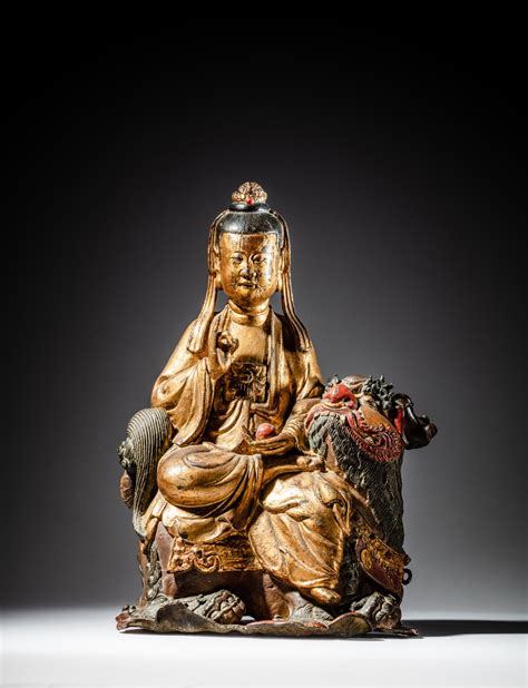 A Gilt And Polychrome Lacquer Bronze Figure Of A Bodhisattva On A Lion