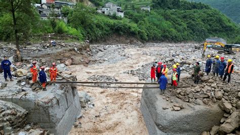 Rescuers Search For Dozens Missing After Flooding And Bridge Collapse