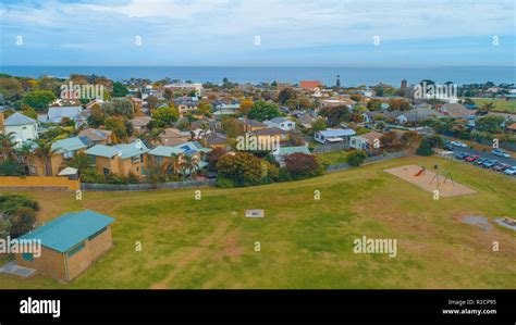 Suburban area and grassy park on ocean shore - aerial view Stock Photo - Alamy