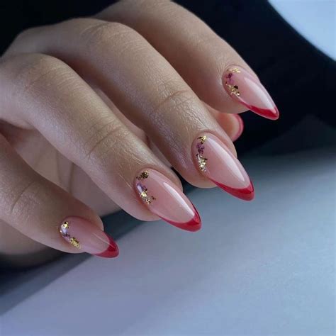 Elegant Nude And Red French Tip Nails With Gold Foil Accents Unhas