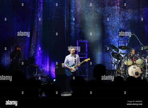 Members of the Irish rock band The Cranberries perform during a concert ...