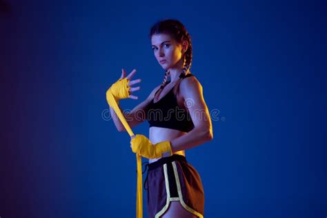 Fit Caucasian Woman in Sportswear Boxing on Blue Studio Background in ...