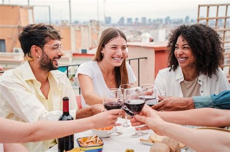 Premium Photo Group Of Happy Friends Clinking Glasses Of Red Wine