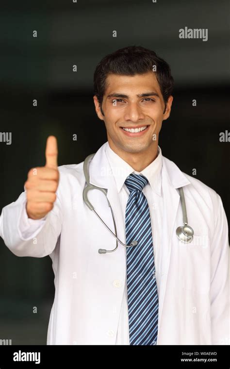 Portrait Of A Male Doctor Showing Thumbs Up Sign Stock Photo Alamy