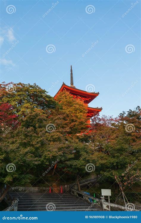 Red Japanese Pagoda In Kiyomizu Dera Temple At Sunset Against Blue Sky