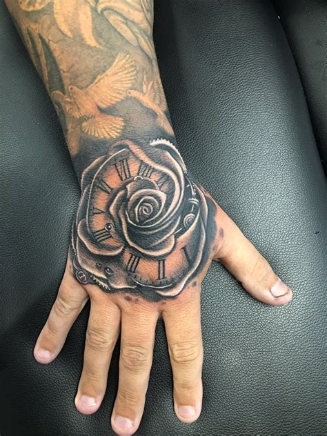 Rose Hand Tattoo By Greg At Holy Trinity Tattoos Rose Hand Tattoo Hand Tattoos For Guys Hand