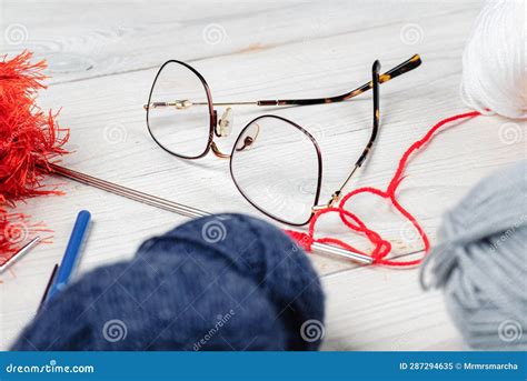 Glasses With Threads For Knitting On A White Wooden Table Knitting Accessories Concept Stock