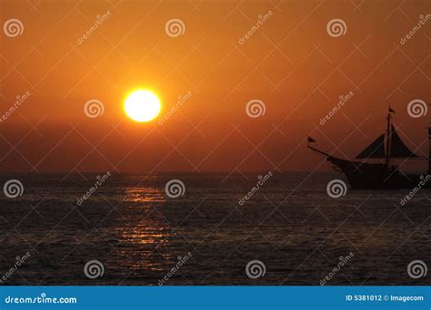 Sailboat and ocean sunset stock photo. Image of vessel - 5381012