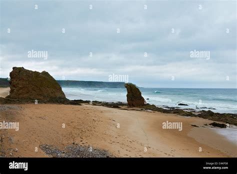 Beach at Cullen in Scotland with the Cullen rocks Stock Photo - Alamy