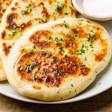 Addictive Homemade Garlic Naan Bread Fluffy And Chewy Nurtured Homes