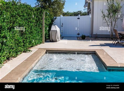 The Hot Tub Spa Tanning Ledge Portion Of A New Swimming Pool With Tan