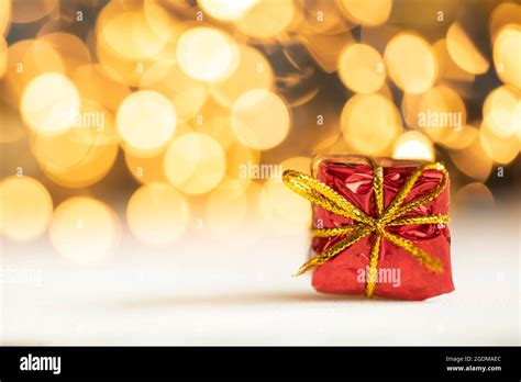 Christmas Present Red And Silver Baubles Against Bokeh Lights Gold