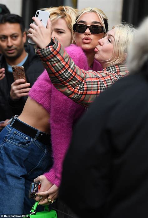 Dua Lipa Flashes Her Abs In A Hot Pink Crop Top As She Greets Fans At BBC Radio Studios Daily