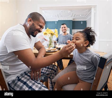 Gay Couple Breakfast And Dad Feeding Kid Meal Food Or Cereal For Morning Wellness Care And
