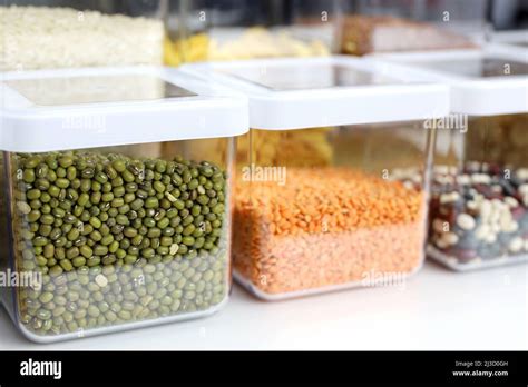 Transparent Containers Filled With Legumes And Cereals On The Shelf In