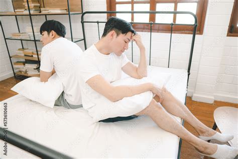 Asian Gay Couple Having Argument With Each Other In Bedroom Gay Couple Relationship Conflict