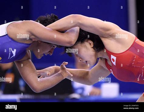 Yui Susaki In Red Of Japan Wins Against Ritu Phogat Of India In The Quarterfinal Of The Women