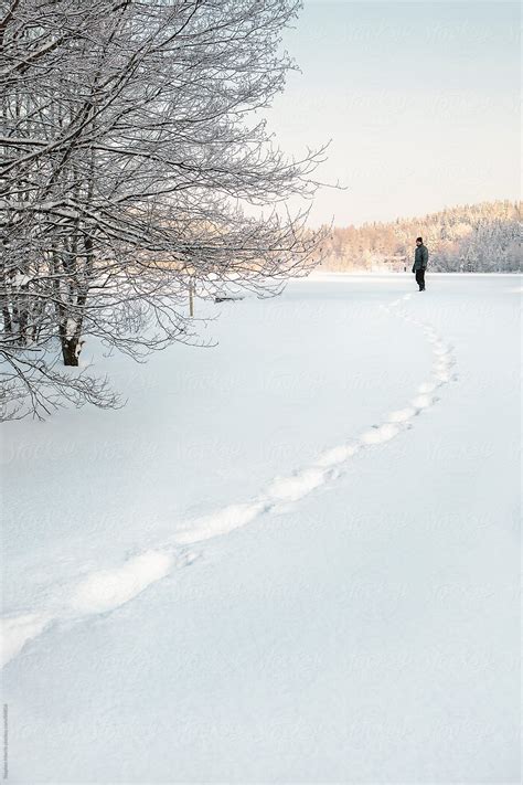 Man Leaving Tracks In Snow By Stocksy Contributor Stephen Morris