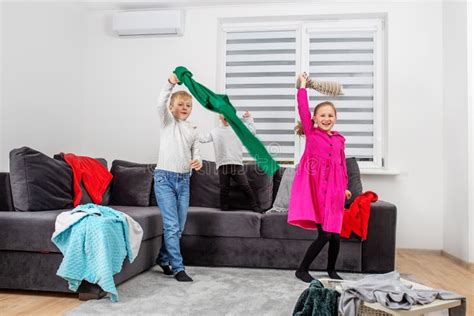 Three Children Are Having Fun In Room And Making Mess Happy Childhood