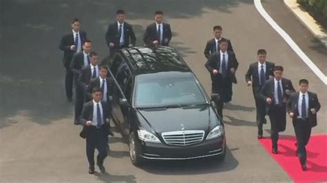 Kim Jong Un's Bodyguards Jog in Perfect Formation Alongside Limo as He ...