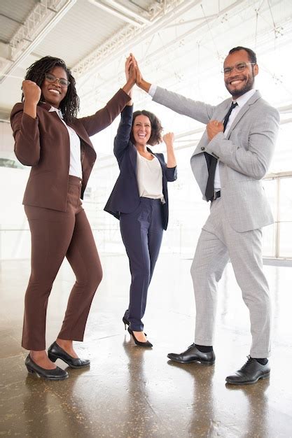 Free Photo Happy Business Team Celebrating Success