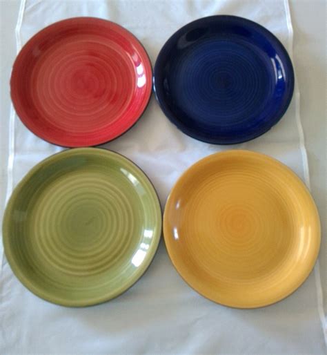 A Complete Set Of 4 105 Gibson Dinner Plates In Their Swirled Pattern