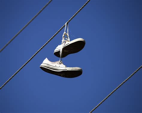 Shoes Tied On Power Lines A Symbol Of Urban Culture And Mystery Shoes