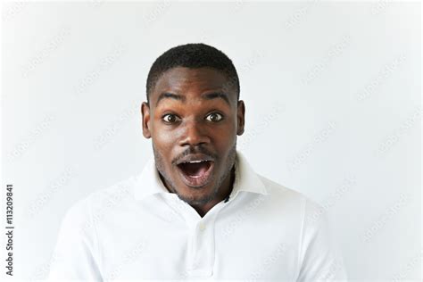 Portrait Of Excited African American Screaming And Looking At The