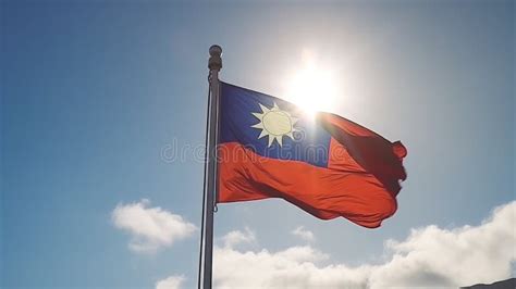 Taiwanese Flag Waving In The Wind On Blue Sky Background With Sun Flare