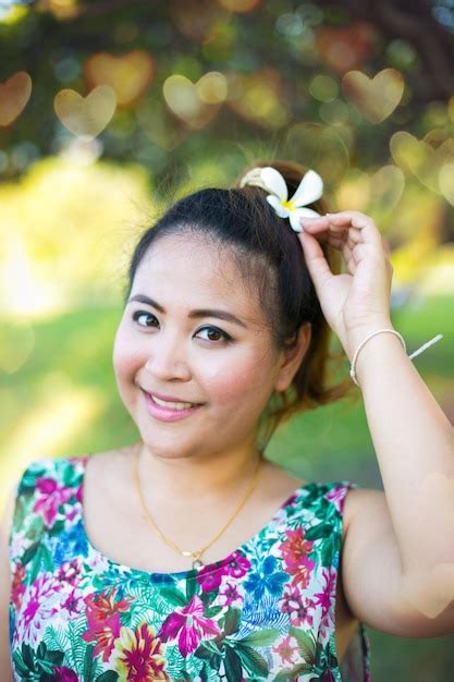 Premium Photo Portrait Of Smiling Mid Adult Woman In Park