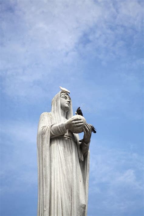 A Statue of the Virgin Mary in the Blue Sky Stock Image - Image of ...