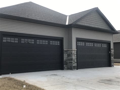 Modern Gray House with Black Garage Doors