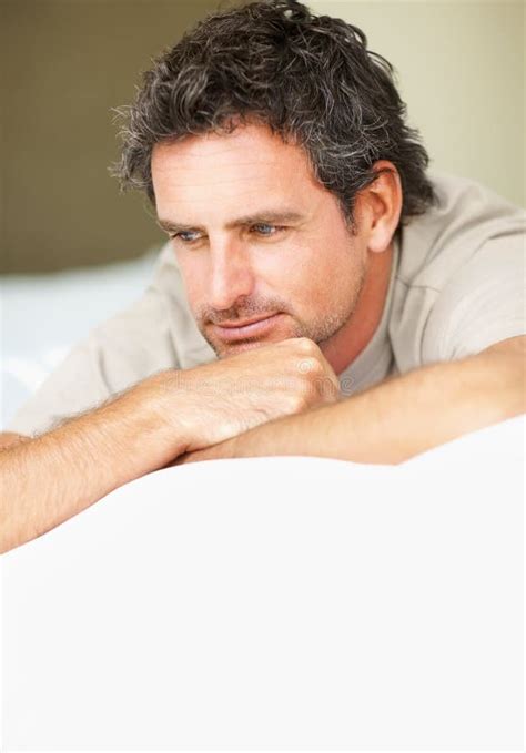 Mature Man Relaxing On Bed Thoughtful Mature Man Relaxing On Bed