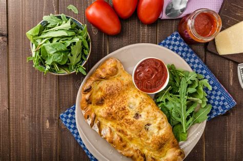 Calzone pizza stock image. Image of homemade, herb, knife - 22039231