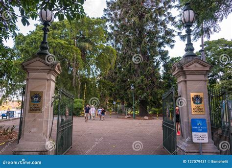 City Botanic Gardens Entrance With Open Gates And People Walking