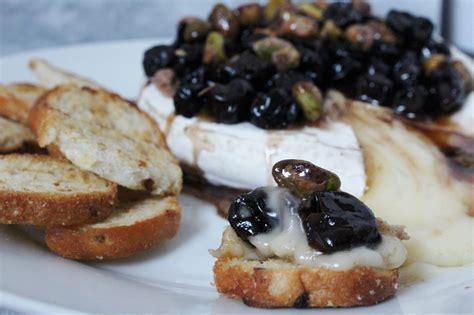 Baked Brie With Balsamic Cherries Pistachios And Cinnamon Honey Zest And Simmer