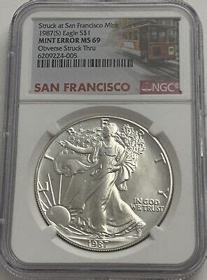 1987 S 1 NGC MINT ERROR MS69 AMERICAN SILVER EAGLE OBVERSE STRUCK THRU