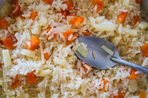 Premium Photo Rice With Carrot And Onion In A Frying Pan Top View