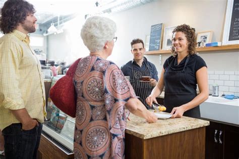 Owner With Colleagues And Customers At Cafe Stock Image Image Of