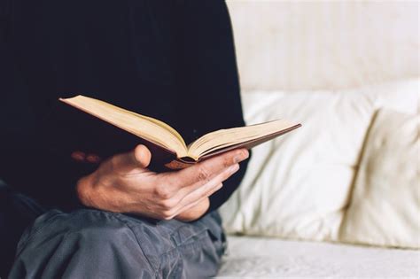 Premium Photo Man Holding Open Book In Hands