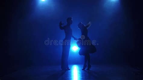 Silhouette Of Pair Dancers Performing Latin Dance In Slow Motion Stock