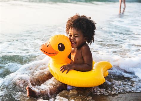 african descent kid enjoying bath tub royalty  stock photo