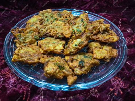 Premium Photo A Plate Filled With Crispy And Tasty Pakora Street Food