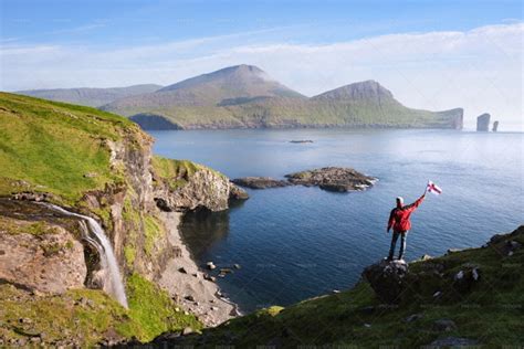 Hiking With Drangarnir View On Vagar, Faroe Islands - Stock Photos | Motion Array