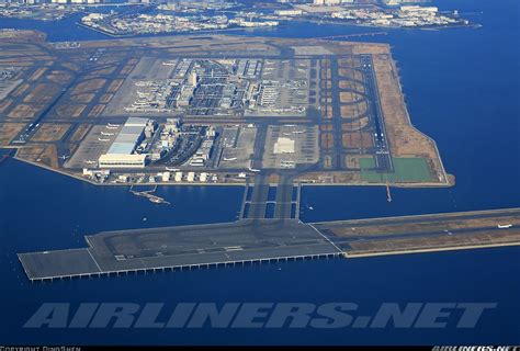 An Aerial View Of The Airport And Its Surrounding Area Taken From A Plane Window