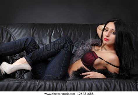 Beautiful Brunette Lying On Leather Couch Stock Photo 126481688 Shutterstock