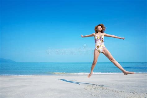 Happily Jumping Fit Attractive Woman Stock Photo Image Of